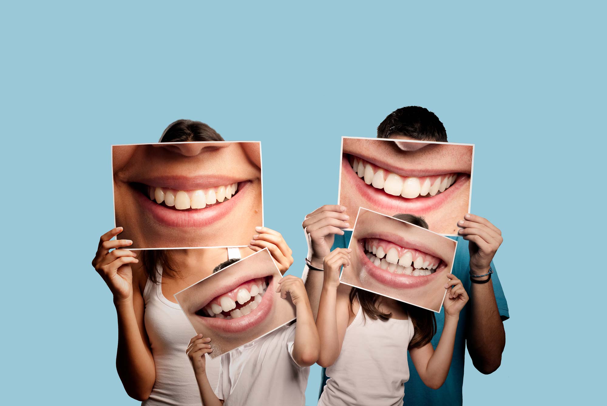 people-holding-teeth-photos