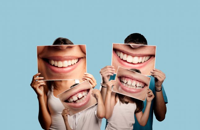 people-holding-teeth-photos